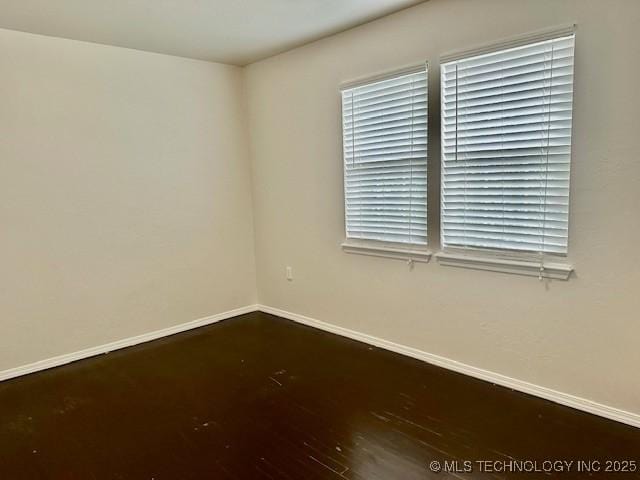 16 Q St SW, Ardmore, OK 73401 - spare room featuring baseboards