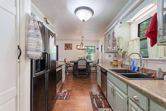 62820 E 312th Rd, Grove, OK 74344 - kitchen featuring a sink, appliances with stainless steel finishes, light countertops, glass insert cabinets, and green cabinets