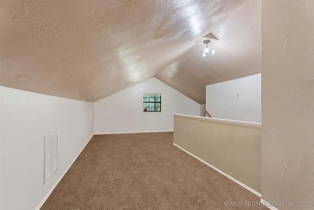 62820 E 312th Rd, Grove, OK 74344 - bonus room with vaulted ceiling, carpet, and baseboards