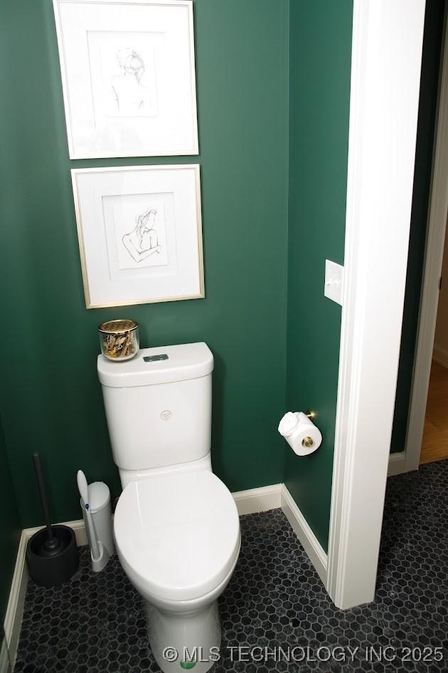2233 E 32nd St, Tulsa, OK 74105 - bathroom featuring baseboards, toilet, and tile patterned floors