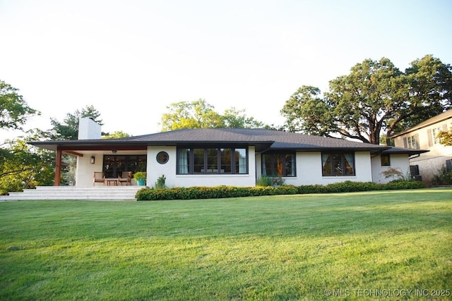 2233 E 32nd St, Tulsa, OK 74105 - single story home with a chimney, a front yard, and stucco siding