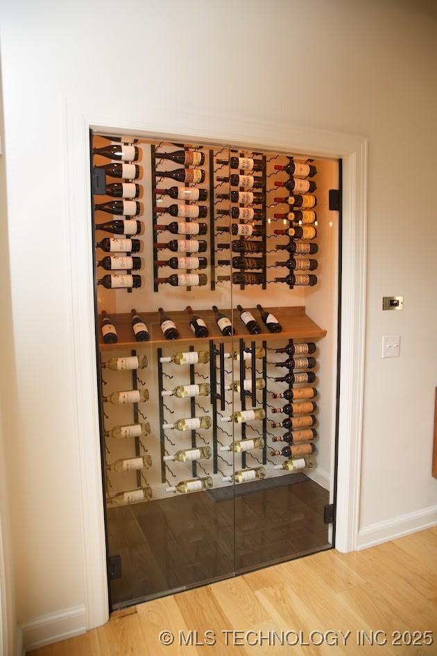 2233 E 32nd St, Tulsa, OK 74105 - wine area featuring wood finished floors and baseboards