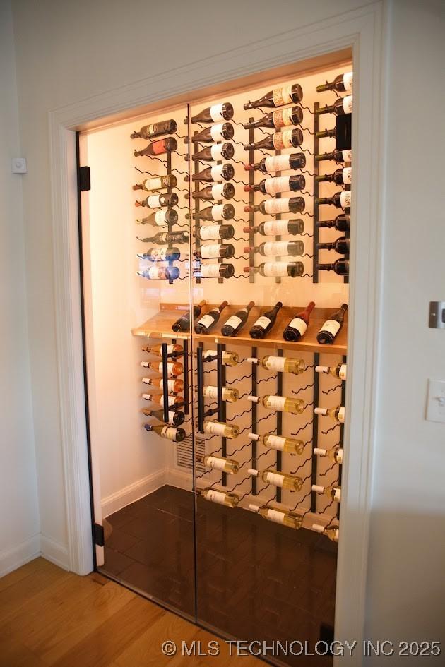 2233 E 32nd St, Tulsa, OK 74105 - wine cellar featuring wood finished floors and baseboards