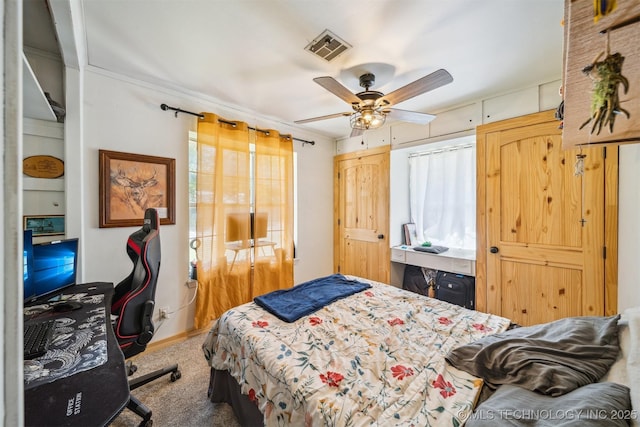 303 SE 3rd St, Pryor, OK 74361 - bedroom with carpet flooring, multiple windows, and ceiling fan
