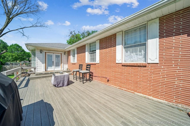 303 SE 3rd St, Pryor, OK 74361 - deck with french doors and a grill
