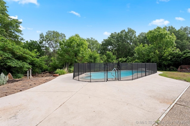 1558 E N Ridge Dr, Vinita, OK 74301 - view of swimming pool featuring a patio and view of scattered trees