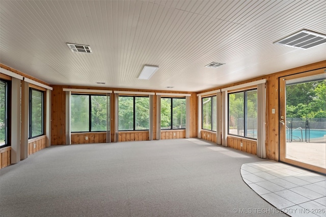 1558 E N Ridge Dr, Vinita, OK 74301 - unfurnished sunroom featuring wooden walls and carpet flooring