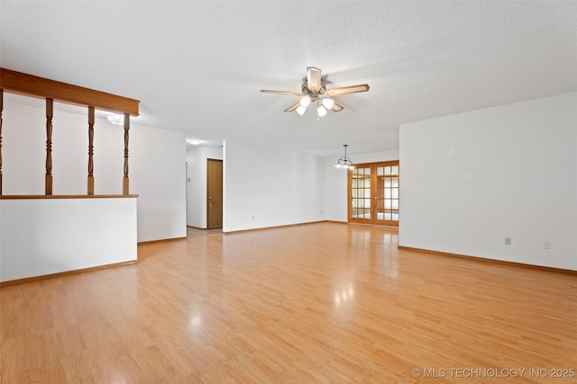 1558 E N Ridge Dr, Vinita, OK 74301 - unfurnished living room with ceiling fan, light wood-type flooring, and baseboards