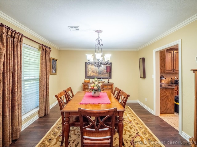 20 Quail, Mcalester, OK 74501 - dining space featuring a chandelier, dark wood finished floors, ornamental molding, and baseboards