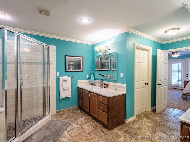 20 Quail, Mcalester, OK 74501 - bathroom with vanity, crown molding, a shower stall, stone finish floors, and baseboards