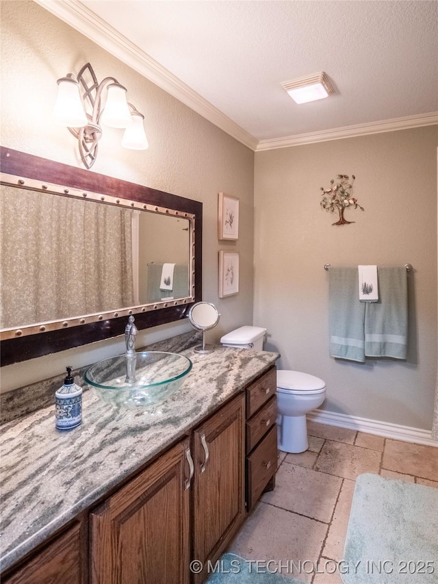 20 Quail, Mcalester, OK 74501 - bathroom with vanity, crown molding, toilet, and stone tile floors