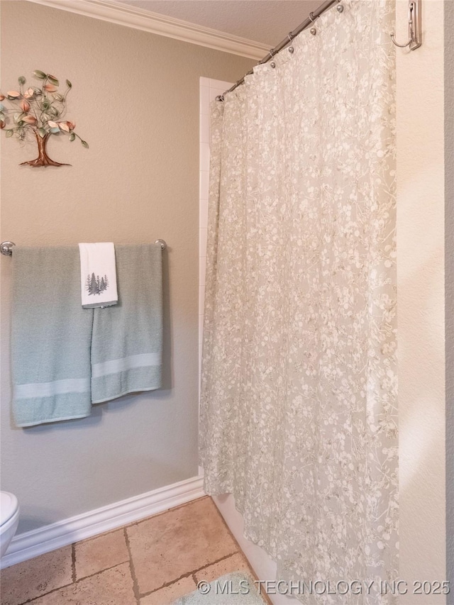 20 Quail, Mcalester, OK 74501 - bathroom with ornamental molding, toilet, baseboards, a shower with shower curtain, and stone tile floors