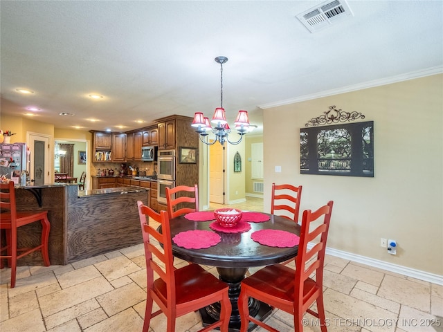 20 Quail, Mcalester, OK 74501 - dining room featuring stone tile floors, a chandelier, baseboards, ornamental molding, and recessed lighting