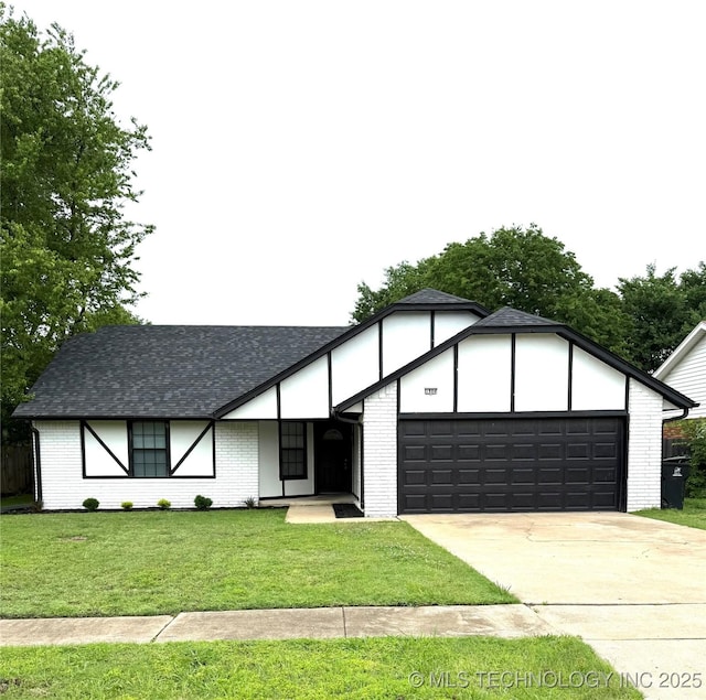 1904 W Honolulu St, Broken Arrow, OK 74012 - view of front of home featuring a garage, driveway, a front yard, brick siding, and a shingled roof