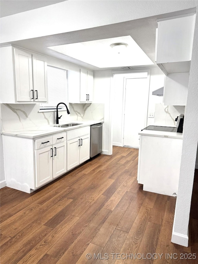 1904 W Honolulu St, Broken Arrow, OK 74012 - kitchen featuring a sink, dishwasher, dark wood-style flooring, white cabinetry, and a tray ceiling