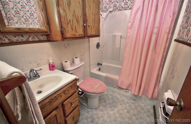 4120 W 53rd St S, Muskogee, OK 74401 - full bathroom with tile walls, vanity, toilet, and shower / tub combo
