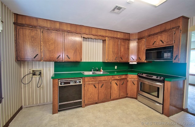 4120 W 53rd St S, Muskogee, OK 74401 - kitchen with black appliances, a sink, light flooring, and brown cabinets