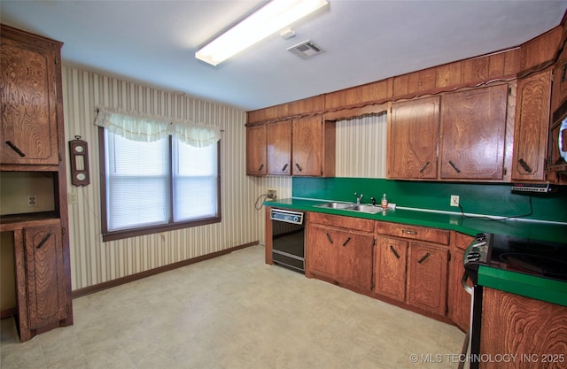 4120 W 53rd St S, Muskogee, OK 74401 - kitchen with dishwasher, stainless steel electric range, a sink, and brown cabinets