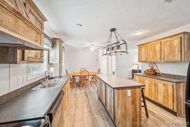150 Private Road 121, Eucha, OK 74342 - kitchen with a sink, a center island, a textured ceiling, ceiling fan, and light wood-type flooring