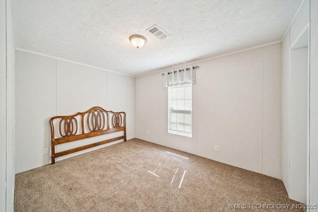 150 Private Road 121, Eucha, OK 74342 - unfurnished bedroom with carpet flooring, crown molding, and a textured ceiling