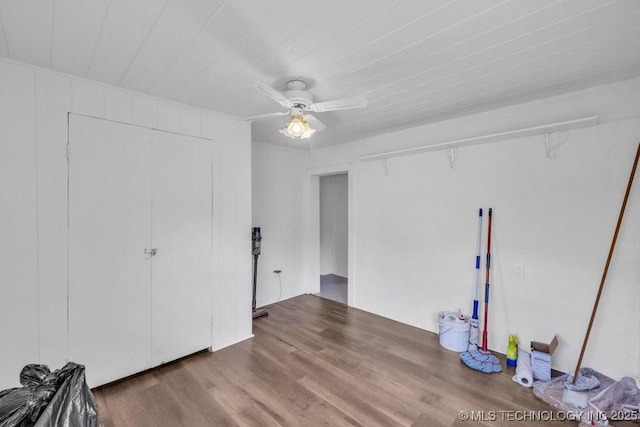 326 E 437th Rd, Spavinaw, OK 74366 - unfurnished bedroom with wood finished floors, ceiling fan, and a closet
