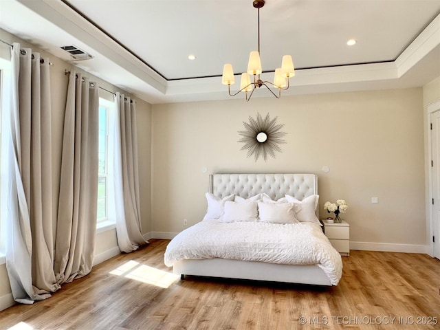 20115 W 111th St S, Sapulpa, OK 74066 - bedroom with baseboards, a chandelier, light wood-style flooring, a raised ceiling, and recessed lighting