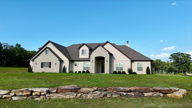 20115 W 111th St S, Sapulpa, OK 74066 - french country style house with stone siding, a front lawn, and a chimney