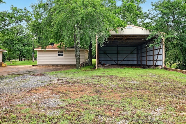 73645 Cyclone Cir, Wagoner, OK 74467 - view of yard with a carport, an outbuilding, and driveway