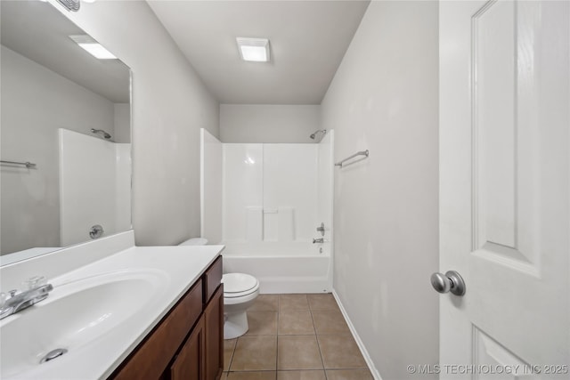2713 N 20th St, Broken Arrow, OK 74012 - bathroom featuring toilet, vanity, tile patterned flooring, bathing tub / shower combination, and baseboards