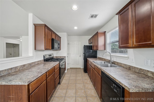 2713 N 20th St, Broken Arrow, OK 74012 - kitchen with black appliances, a sink, light tile patterned flooring, and recessed lighting