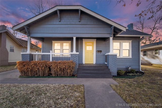 1232 S Gary Pl, Tulsa, OK 74104 - bungalow-style house featuring covered porch and a chimney