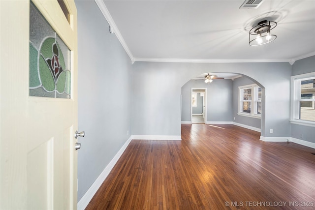 1232 S Gary Pl, Tulsa, OK 74104 - unfurnished room with arched walkways, a ceiling fan, dark wood finished floors, ornamental molding, and baseboards