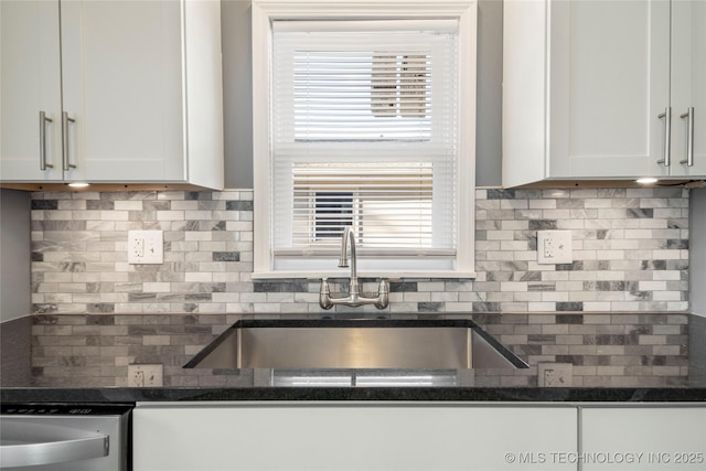1232 S Gary Pl, Tulsa, OK 74104 - kitchen featuring decorative backsplash, a sink, dishwasher, and white cabinets