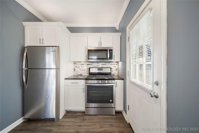 1232 S Gary Pl, Tulsa, OK 74104 - kitchen with stainless steel appliances, ornamental molding, dark countertops, decorative backsplash, and white cabinets