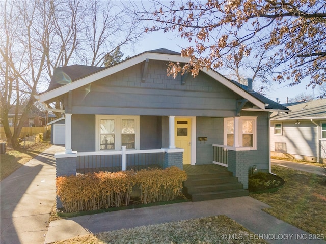 1232 S Gary Pl, Tulsa, OK 74104 - bungalow-style house with a porch and driveway