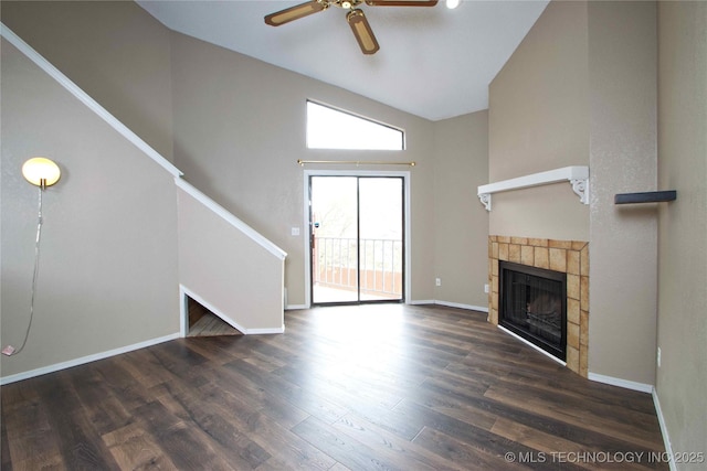6737 S Peoria Ave Unit C213, Tulsa, OK 74136 - unfurnished living room with plenty of natural light, a ceiling fan, a tile fireplace, wood finished floors, and vaulted ceiling