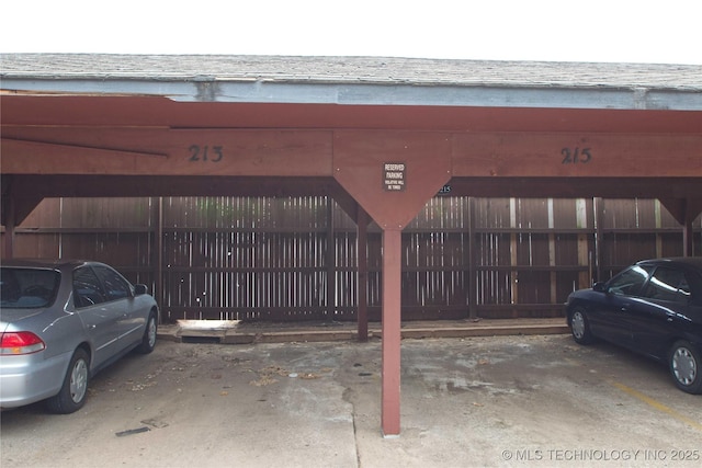 6737 S Peoria Ave Unit C213, Tulsa, OK 74136 - view of property with covered parking