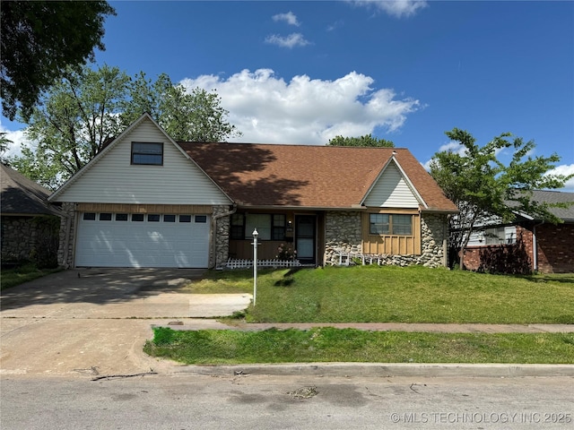10653 E 18th St, Tulsa, OK 74128 - view of front of property featuring stone siding, concrete driveway, a garage, and a front yard