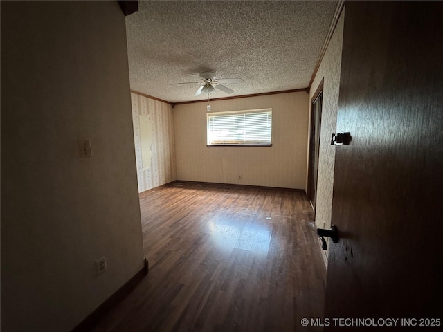 10653 E 18th St, Tulsa, OK 74128 - spare room featuring crown molding, a textured ceiling, a ceiling fan, wood finished floors, and baseboards