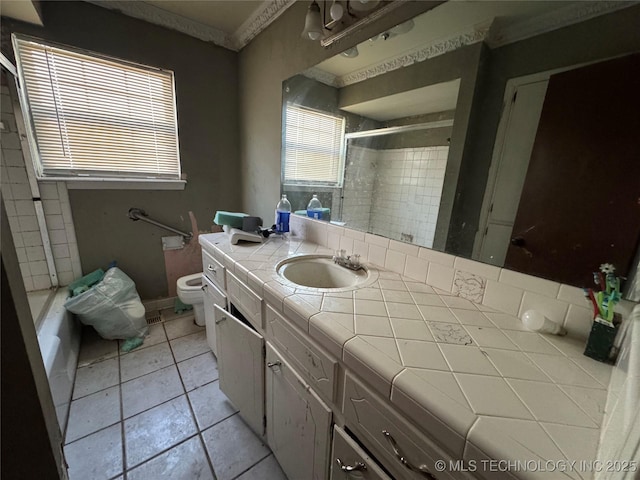 10653 E 18th St, Tulsa, OK 74128 - full bathroom with toilet, vanity, tile patterned floors, and enclosed tub / shower combo