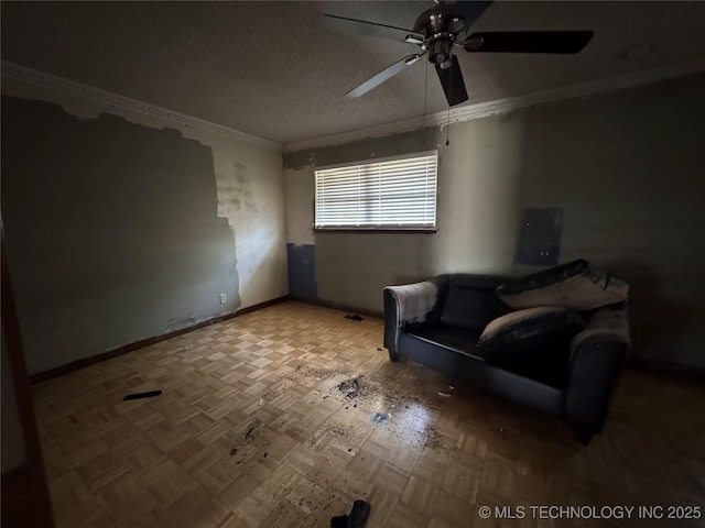 10653 E 18th St, Tulsa, OK 74128 - sitting room featuring a ceiling fan, crown molding, a textured ceiling, and baseboards