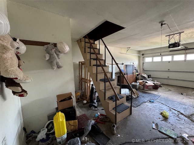 10653 E 18th St, Tulsa, OK 74128 - garage featuring a garage door opener