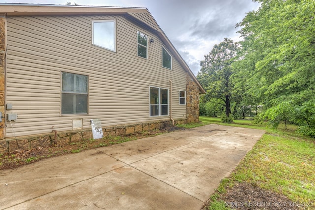 8424 Harp Blvd, Broken Arrow, OK 74014 - view of home's exterior featuring a patio area, a lawn, and concrete driveway
