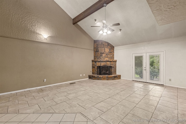 8424 Harp Blvd, Broken Arrow, OK 74014 - unfurnished living room with ceiling fan, light tile patterned floors, a fireplace, french doors, and a textured ceiling