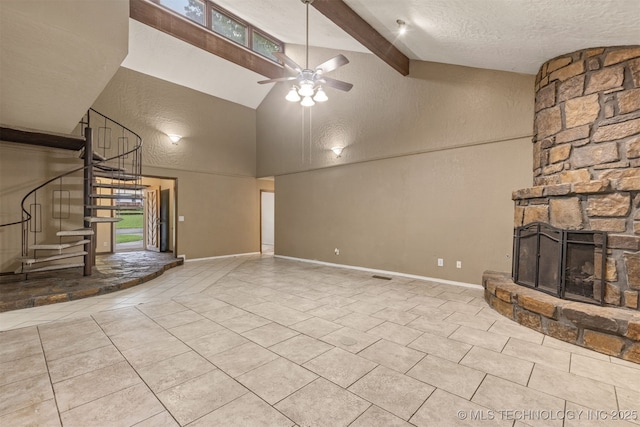 8424 Harp Blvd, Broken Arrow, OK 74014 - unfurnished living room with stairway, tile patterned flooring, a ceiling fan, high vaulted ceiling, and a stone fireplace