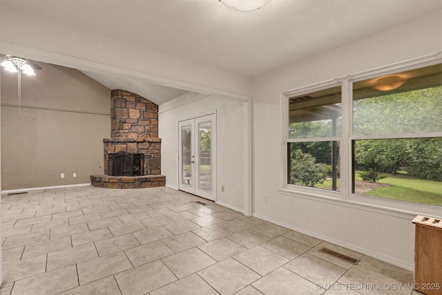 8424 Harp Blvd, Broken Arrow, OK 74014 - unfurnished living room with vaulted ceiling, a stone fireplace, light tile patterned flooring, baseboards, and a ceiling fan
