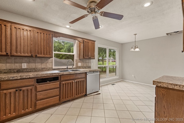 8424 Harp Blvd, Broken Arrow, OK 74014 - kitchen with stainless steel dishwasher, a sink, decorative backsplash, brown cabinets, and a ceiling fan