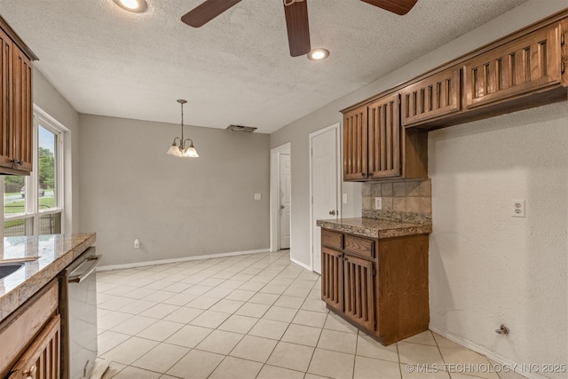8424 Harp Blvd, Broken Arrow, OK 74014 - kitchen featuring ceiling fan, stainless steel dishwasher, tile counters, backsplash, and light tile patterned floors