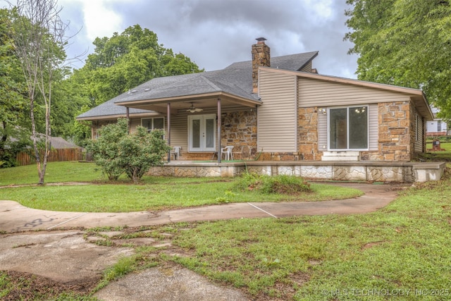 8424 Harp Blvd, Broken Arrow, OK 74014 - back of property featuring stone siding, a ceiling fan, a porch, a chimney, and roof with shingles