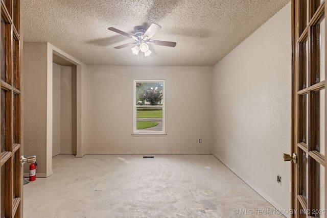 8424 Harp Blvd, Broken Arrow, OK 74014 - unfurnished bedroom featuring a textured ceiling and ceiling fan